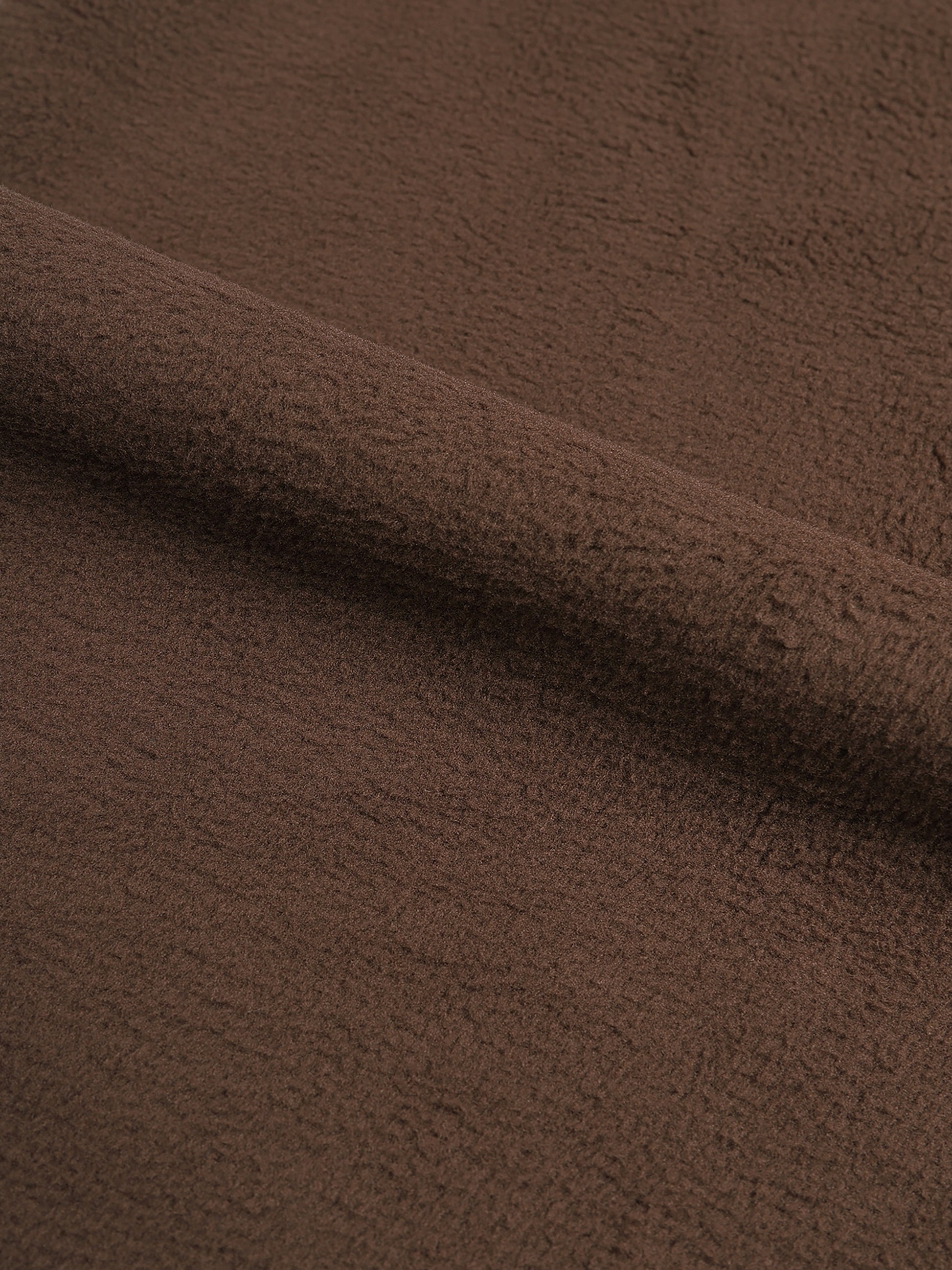 Close-up of brown fabric with a soft texture