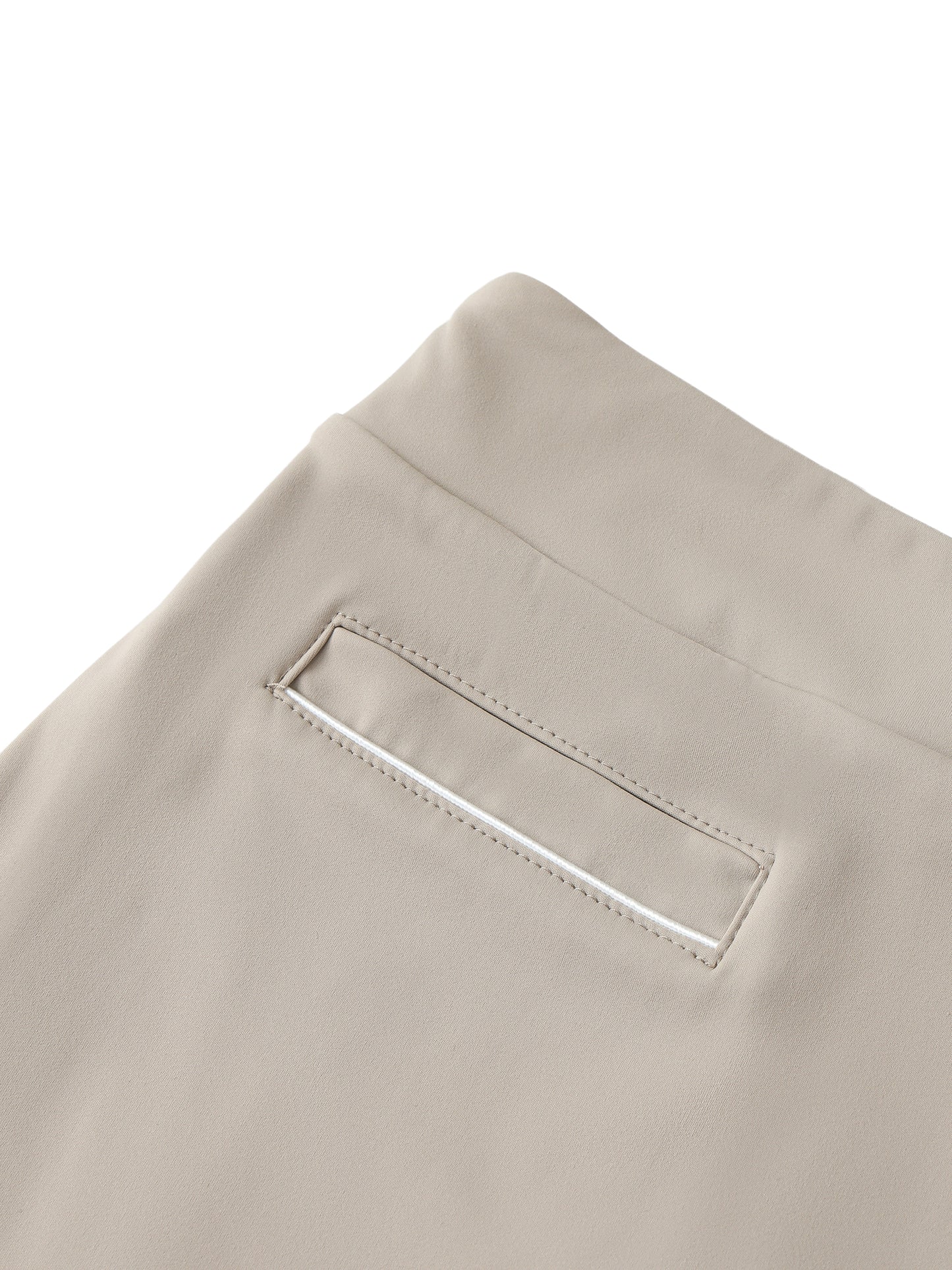 Close-up of beige skirt with a pocket detail on a white background
