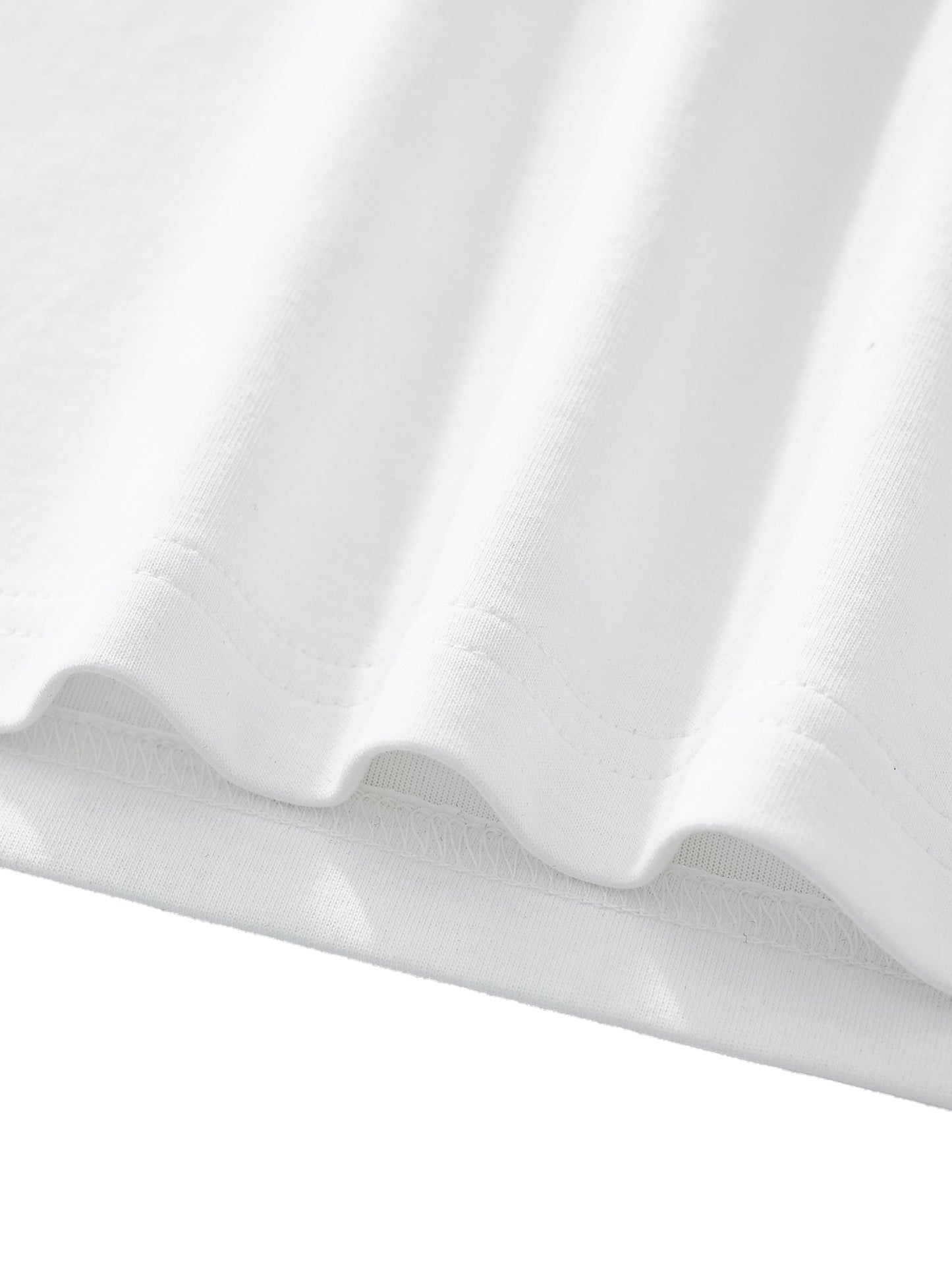 Close-up of white fabric with folds on a light gray background