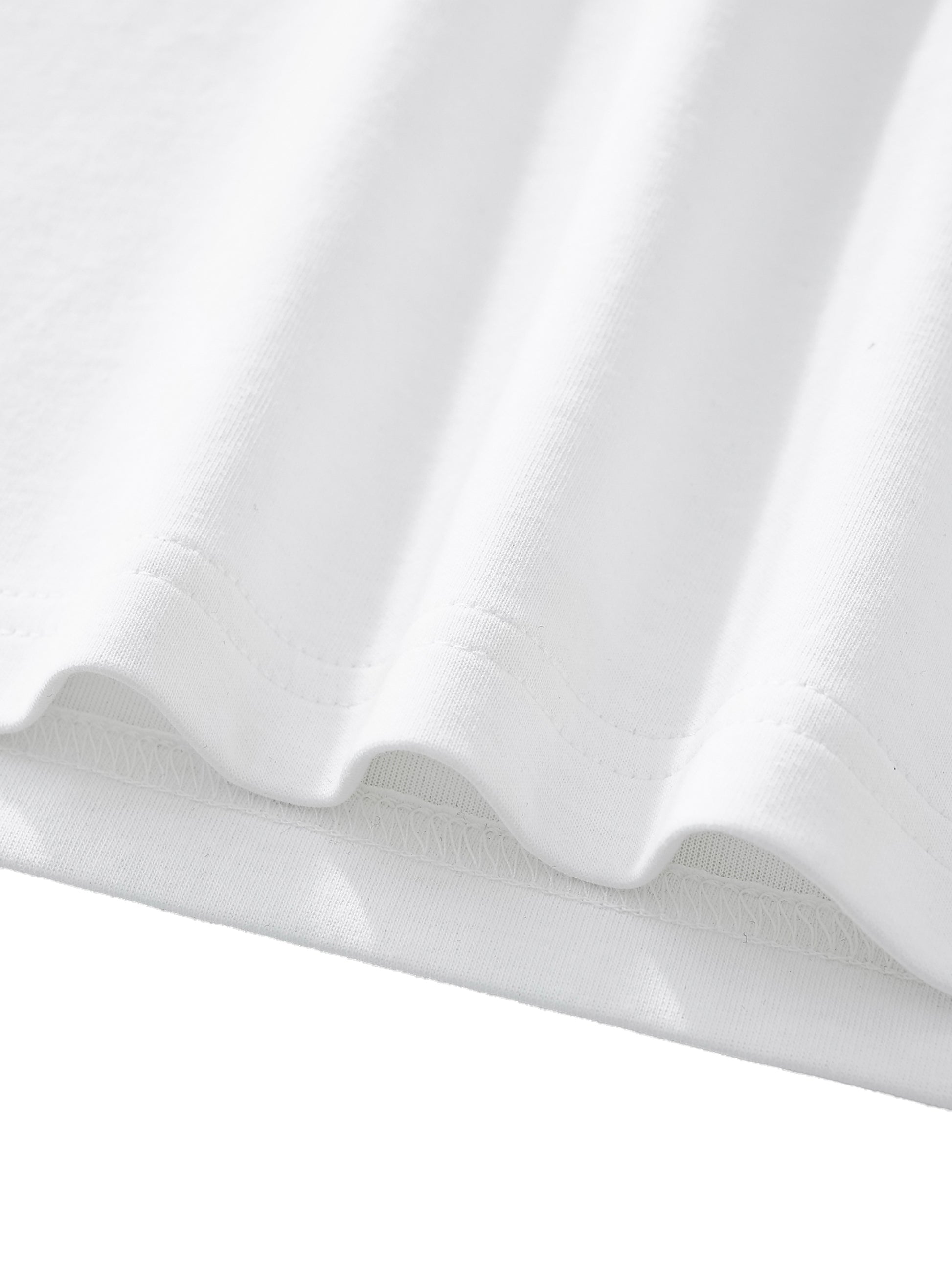 Close-up of white fabric with folds on a light gray background