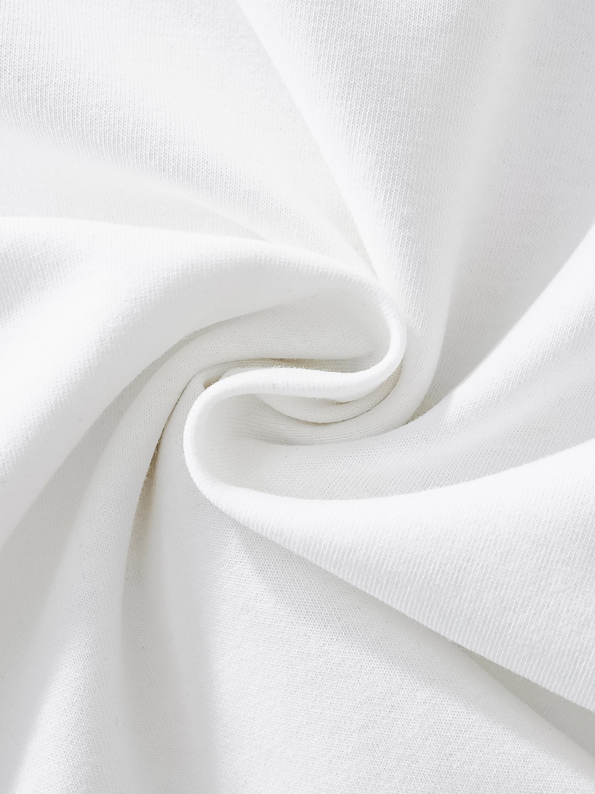 Close-up of white fabric with a subtle wave pattern