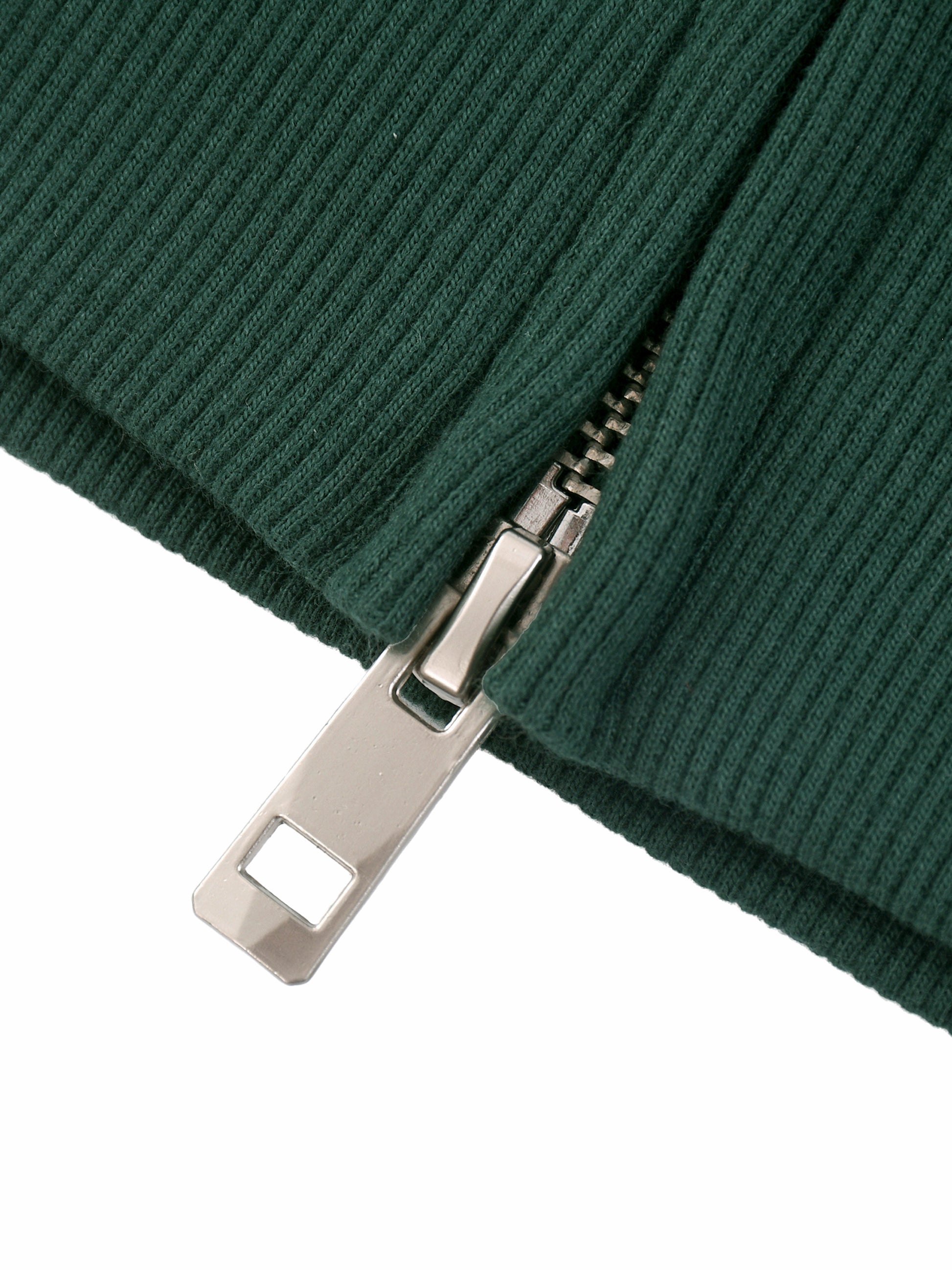 Close-up of a green zip up jacket with a metal zipper on a white background