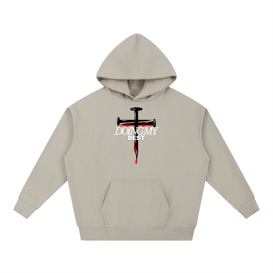 Stone hoodie with a graphic design on a white background. Graphic design consists of 2 black nails in a cross form with red detailing dripping down, in front of it there is 'Doing my best' text in the color white. 