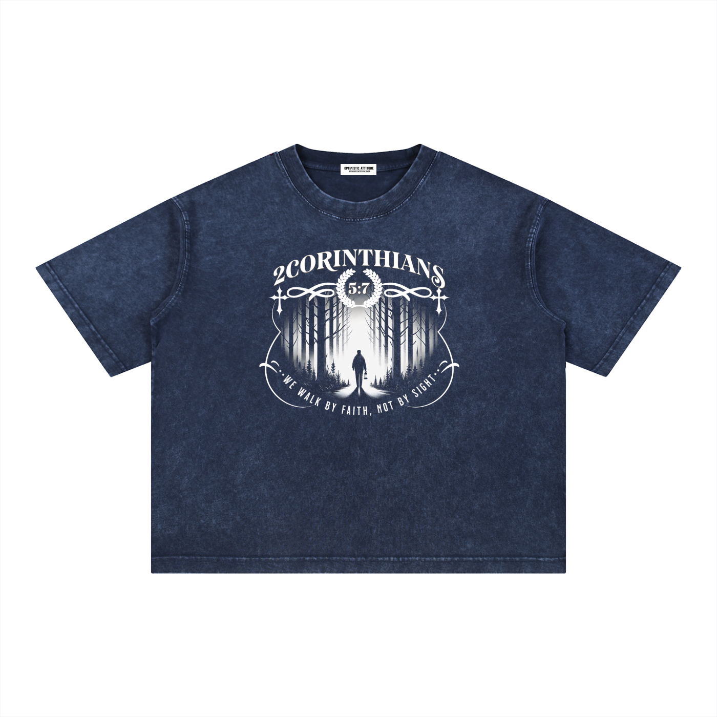 Navy blue t-shirt with white graphic design containing the words "2 corinthians" "we walk by faith, not by sight." with a graphic of a person wondering the woods on a white background.