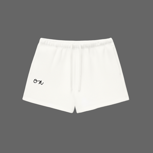 White shorts with a black 'OA' logo in front of a white background