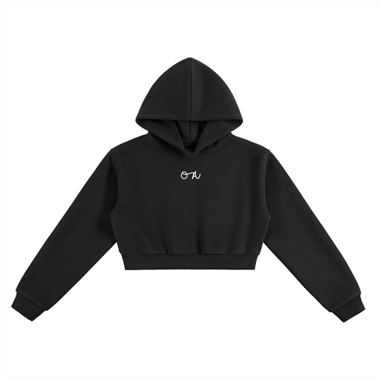 Black cropped hoodie with a small white logo on a white background