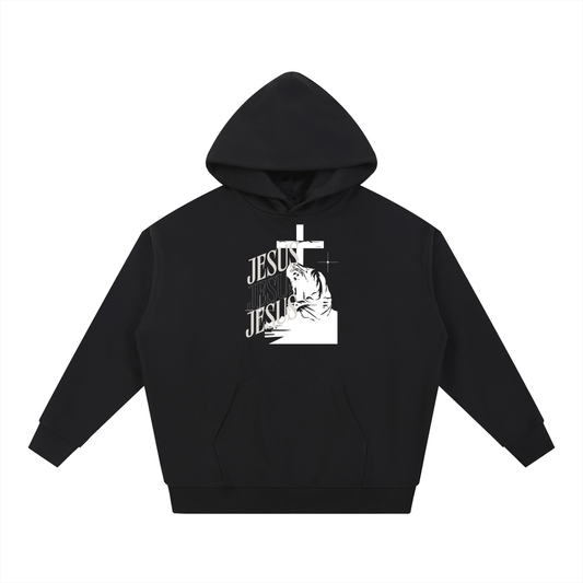 Black hoodie with 'Jesus' text and cross design on a white background