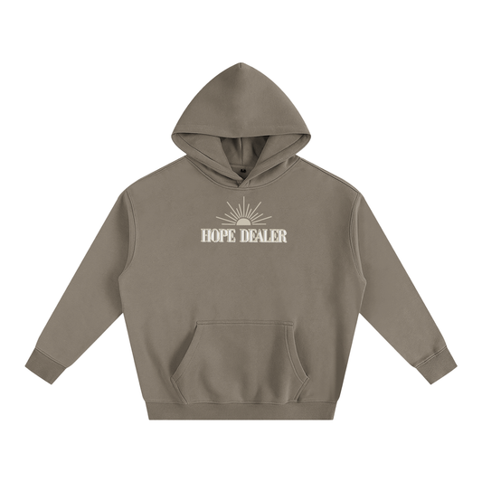 Brown/khaki hoodie with 'HOPE DEALER' text and sun graphic on a white background. Hope dealer text is tan and white and sun graphic is tan.