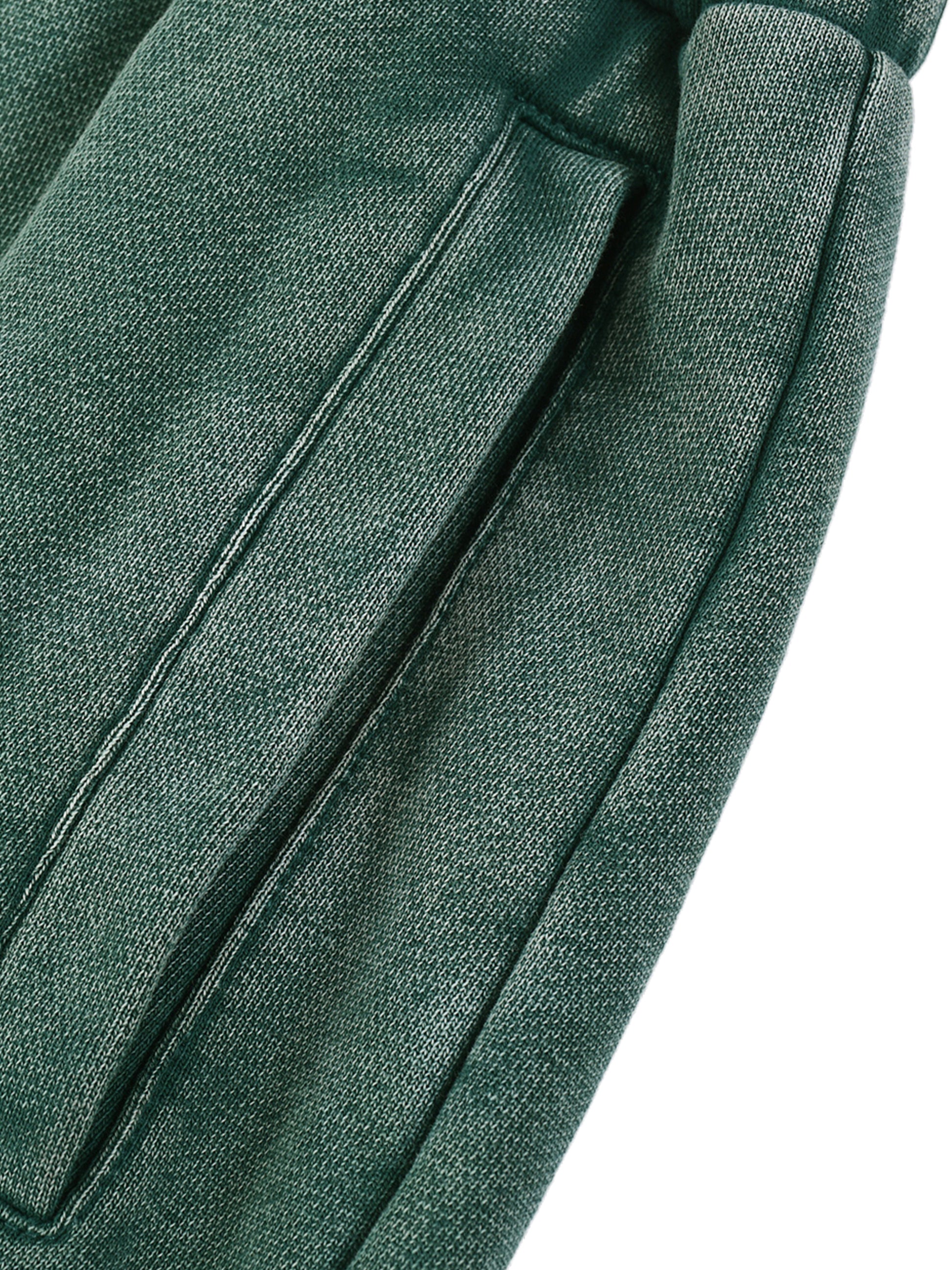 Close-up of green fabric with a white background