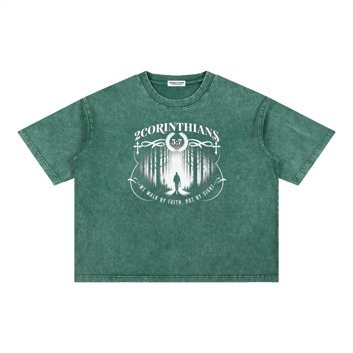 Green t-shirt with white graphic design containing the words "2 corinthians" "we walk by faith, not by sight." with a graphic of a person wondering the woods on a white background.