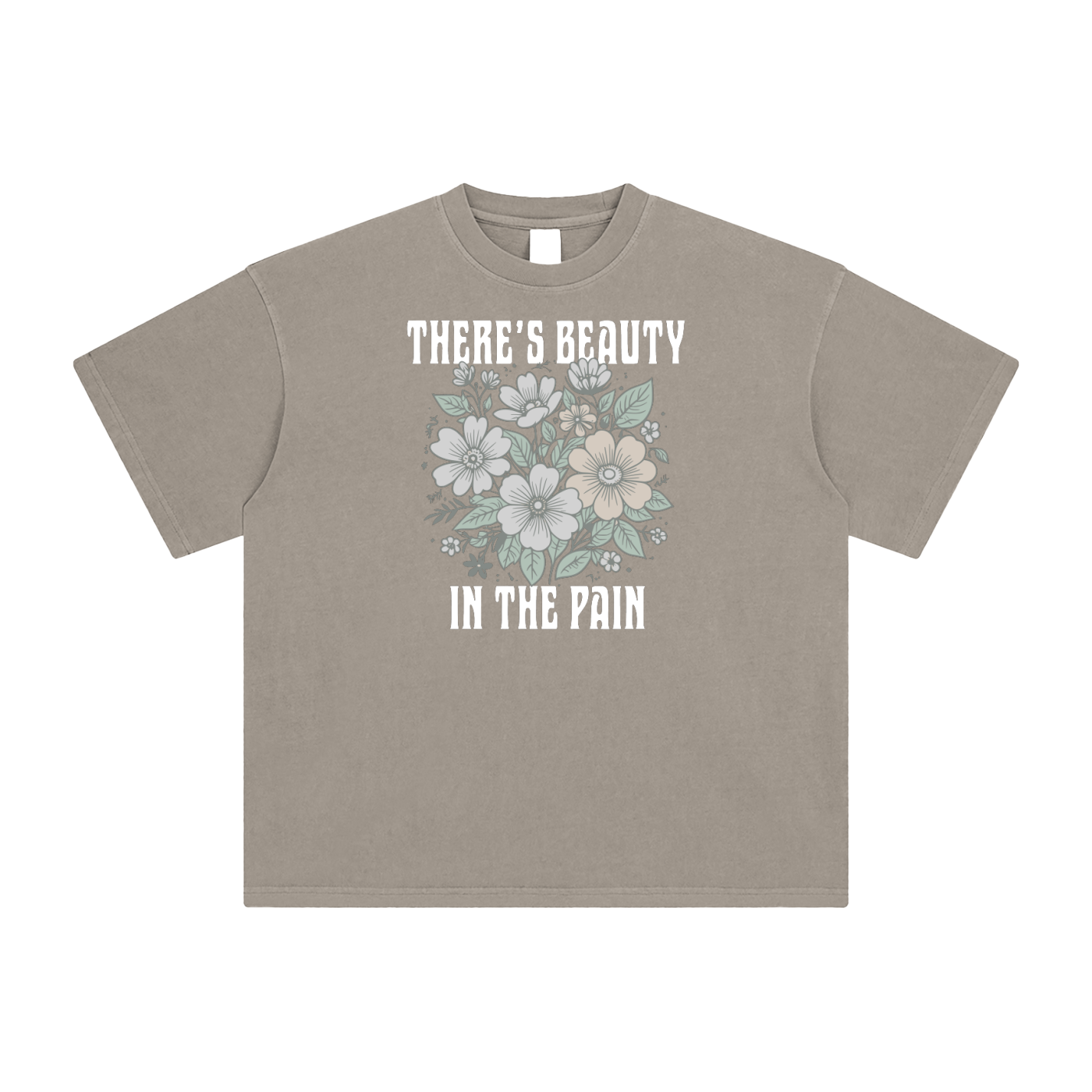 Khaki t-shirt with floral design and text on a white background. Text: "There's Beauty In The Pain".