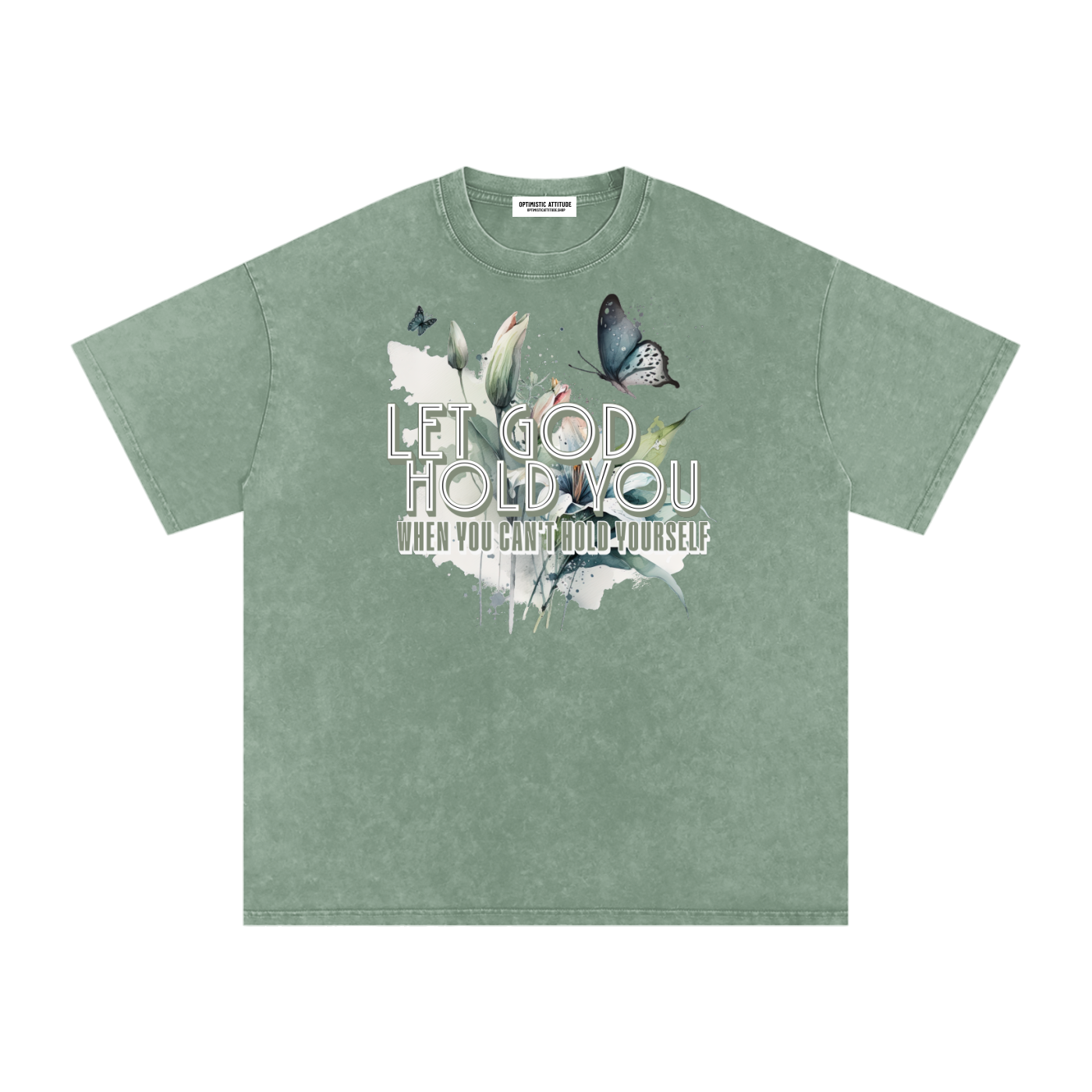 Light/Sage Green t-shirt with nature-themed design and text that says "Let God Hold You, when you can't hold yourself" on a white background.