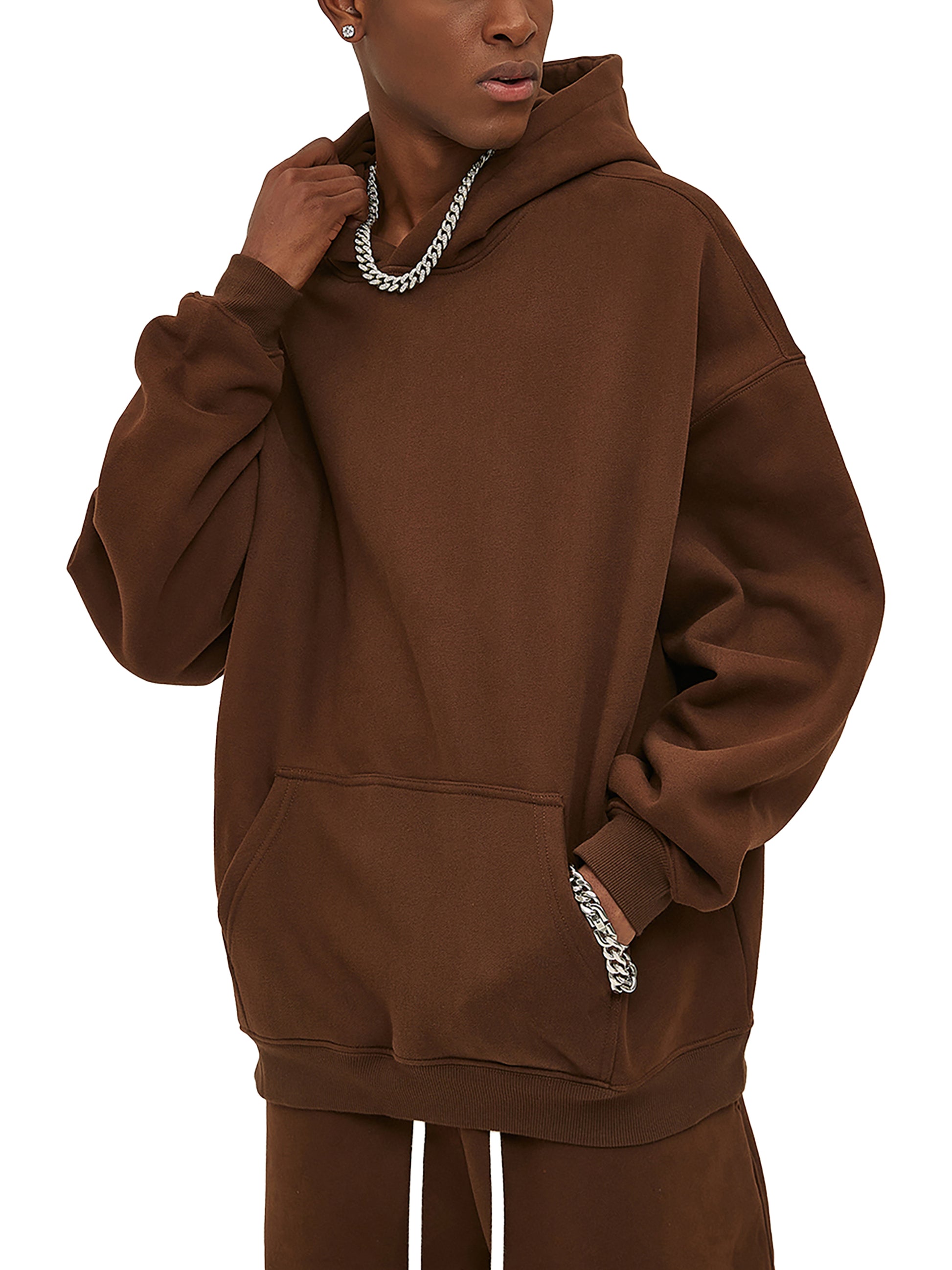 Male modeling the brown hoodie mockup