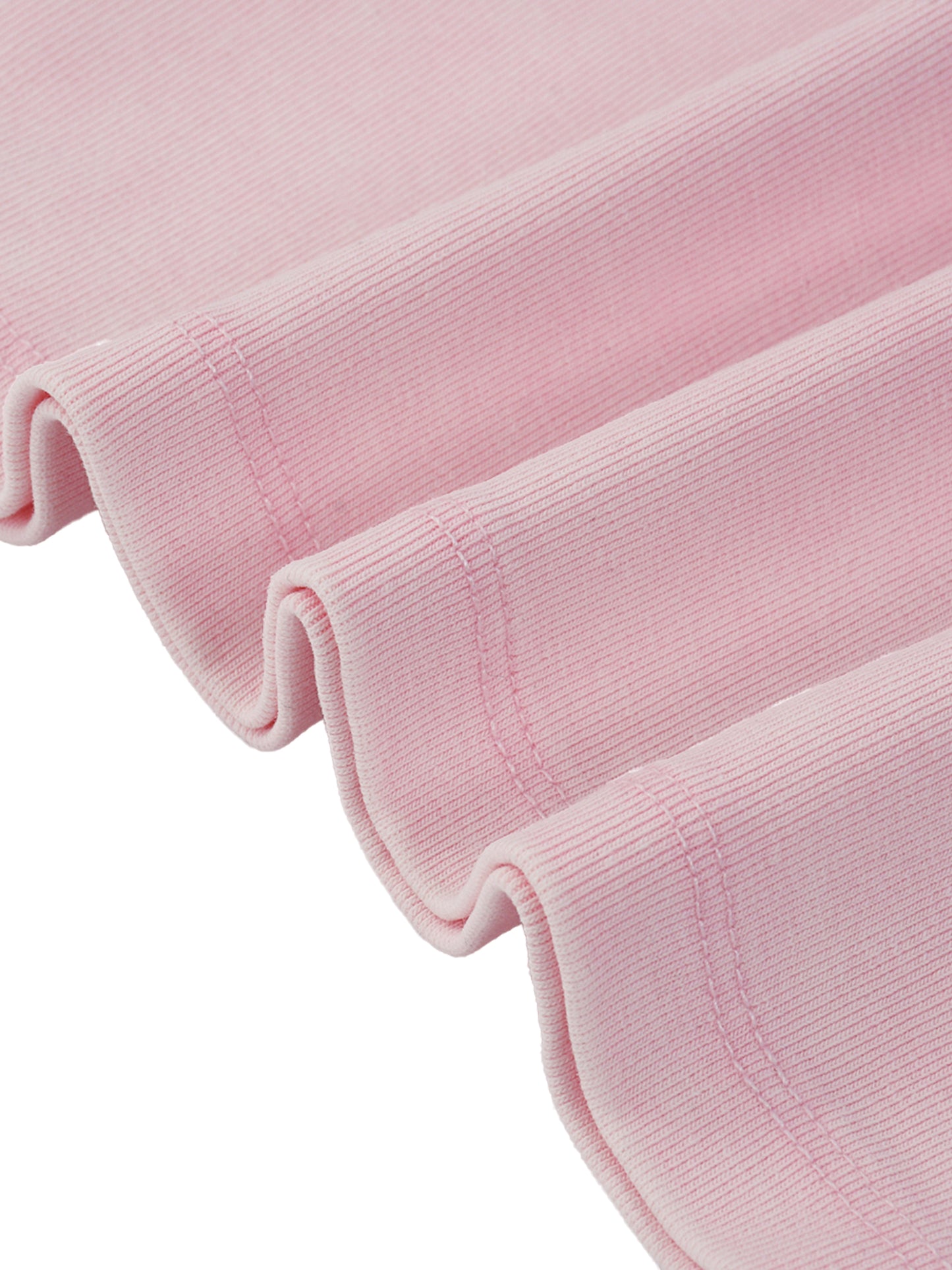 Close-up of a pink textured fabric roll on a white background