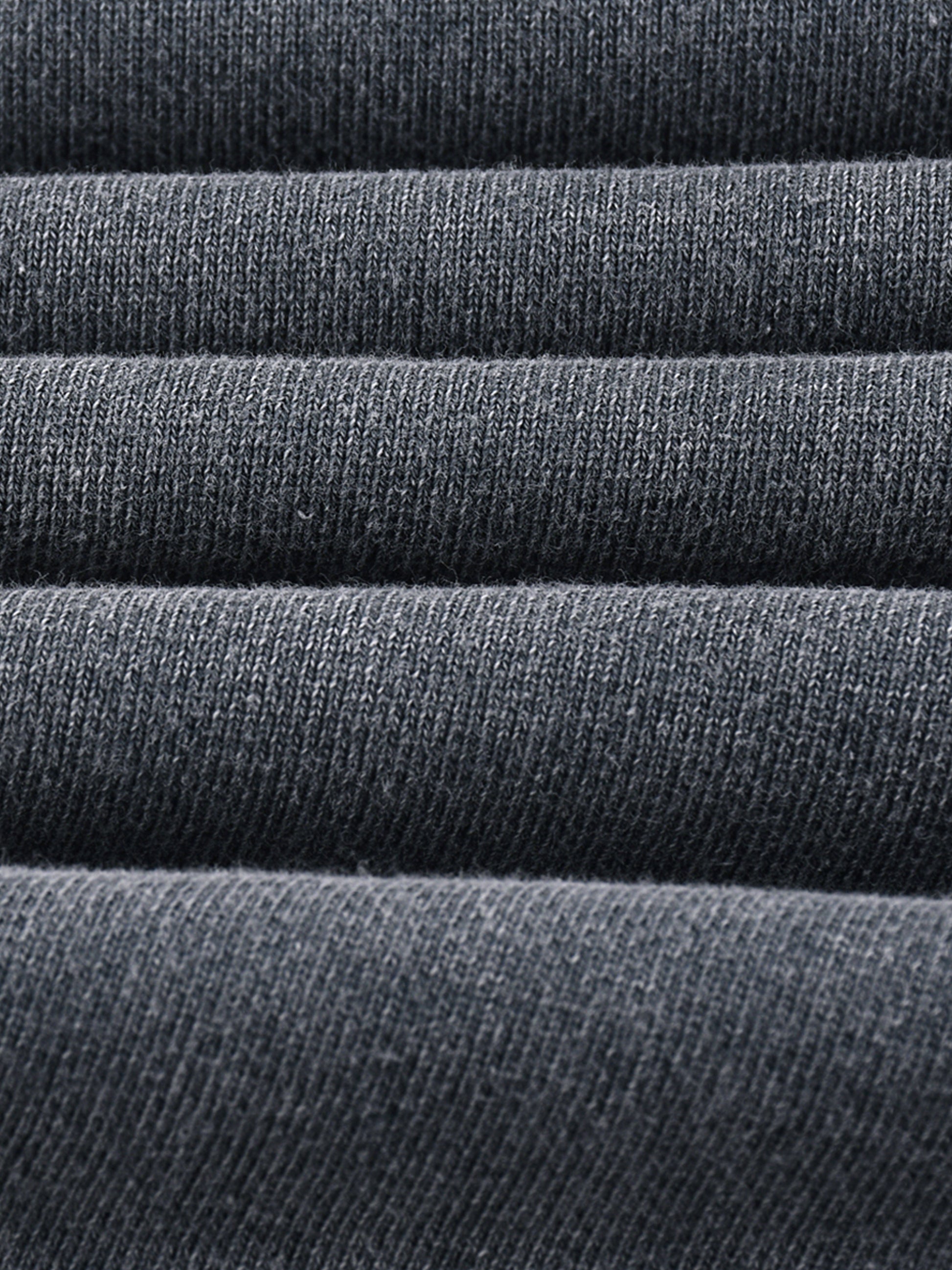 Stack of dark gray fabric rolls