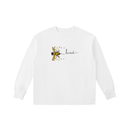 White long-sleeve shirt with a bee and 'be kind' text design on a white background