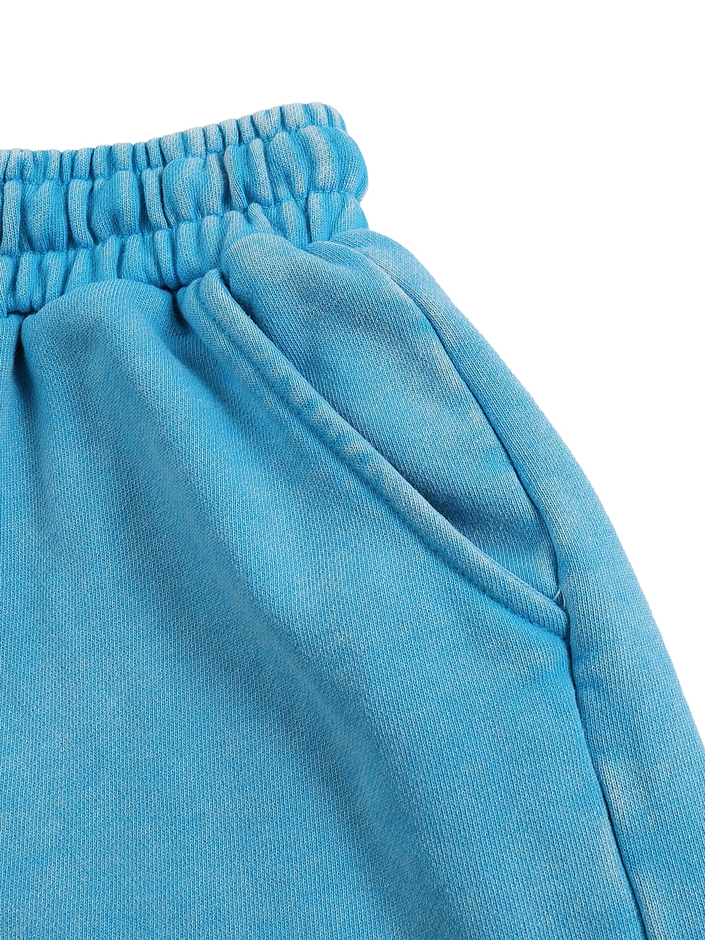 Close-up of blue pants with a white background