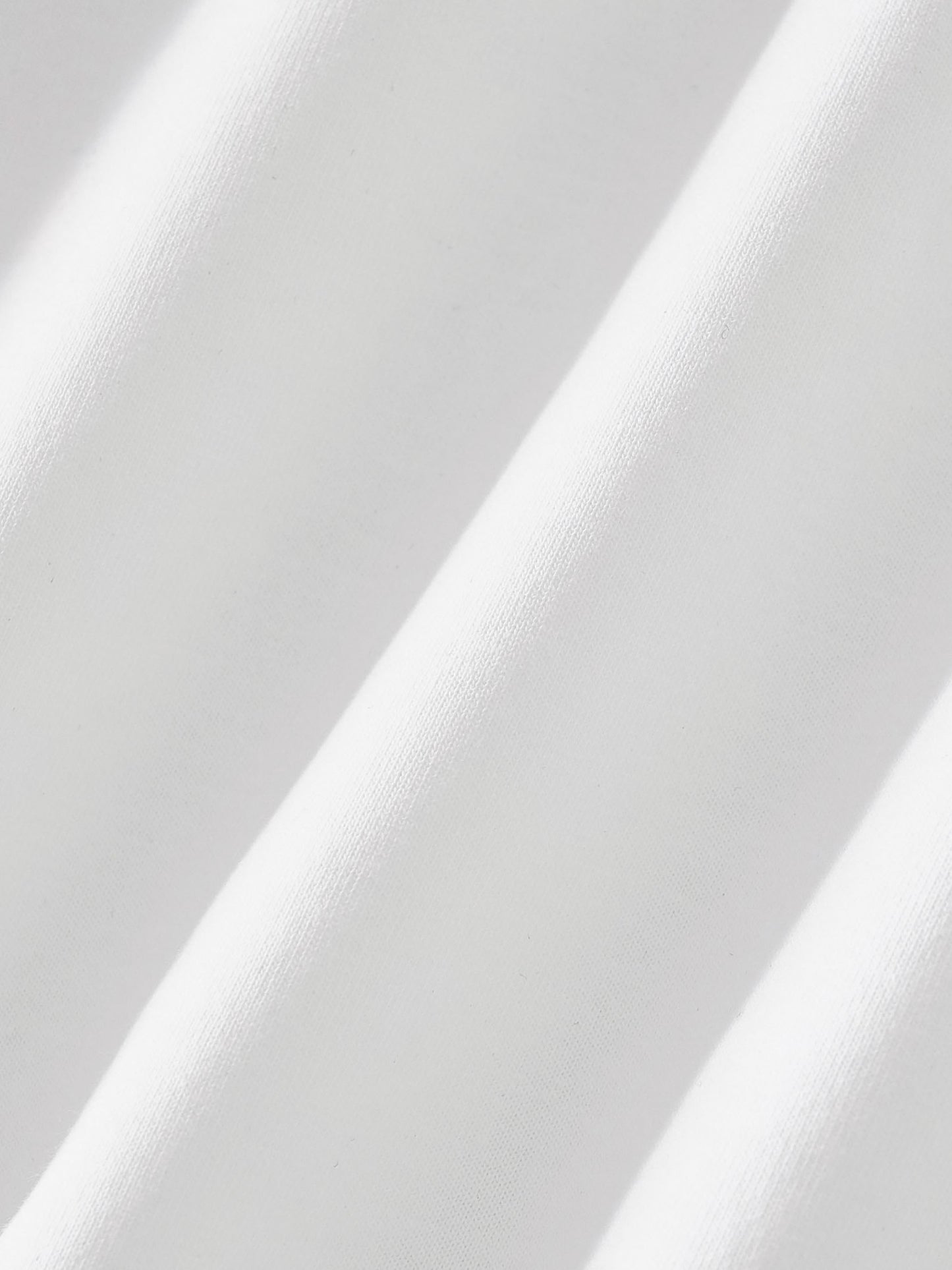 Close-up of white fabric with a subtle pattern