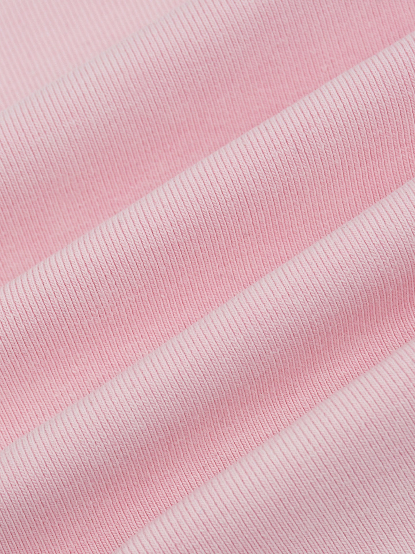 Close-up of pink fabric with a ribbed texture